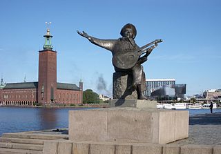 Stockholm city hall and the statue of Evert Taube